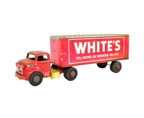 Tinplate Toys - a vintage Marx tinplate ' Whites ' truck and trailer . Lithographed metal in red and white with a detachable 