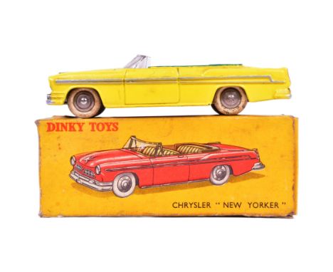 French Dinky Toys - an original vintage French made Dinky Toys diecast model No. 24A Chrysler New Yorker 1955. Yellow with wh