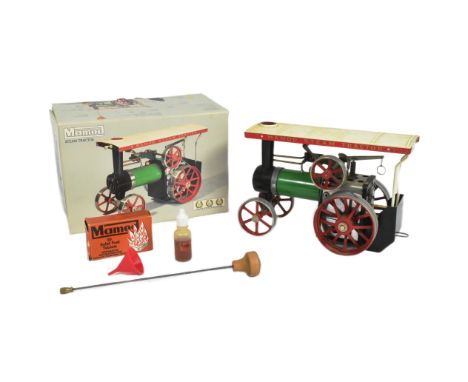 An original vintage Mamod live steam model Steam Tractor TE1A Traction Engine. A green and red model of a solid fuel example.