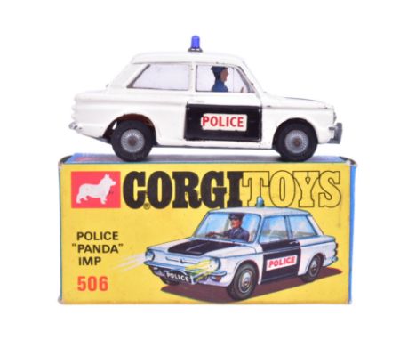 Diecast - an original vintage Corgi Toys boxed diecast model No. 506 Police ' Panda ' Imp. White body with black bonnet, brow