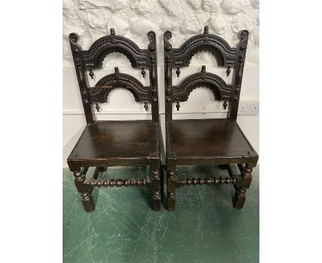 Pair of 18th Century Oak Framed Arch Carved Bar Back Hall Chairs on turned legs with front twisted cross stretcherProvenance: