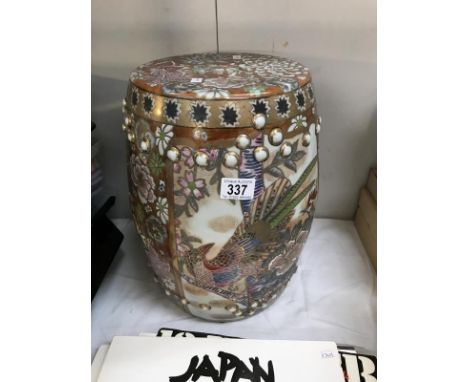 An oriental pottery barrel stool/plant stand