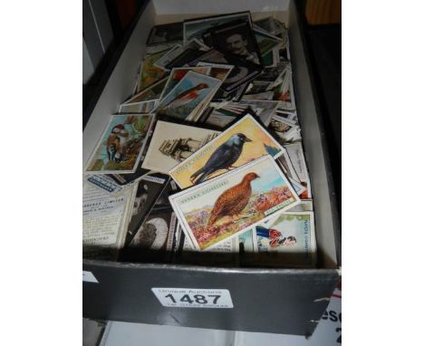 A shoe box of assorted cigarette cards including Ogden's, Carreras, John Player, Wills etc.,