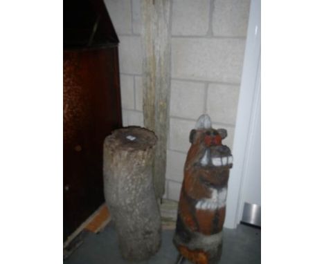 A carved wood caricature  dog, trunk &amp; driftwood