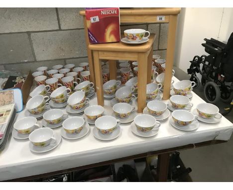 Large quantity of Nescafe mugs and cups and saucers, including one boxed