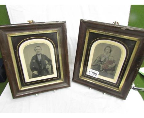 A pair of framed and glazed Victorian portrait photographs.
