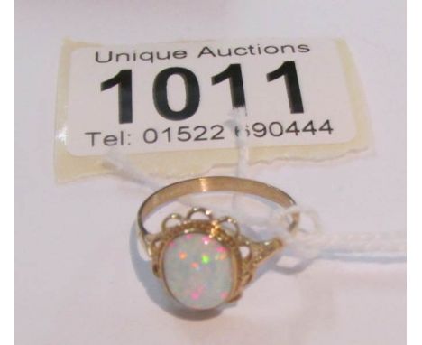 A 9ct gold ring set opal, size O.