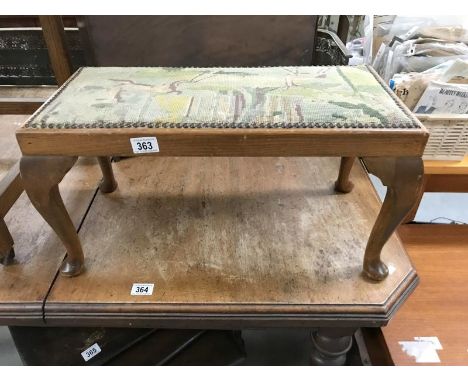 A wool work tapestry topped stool on Queen Anne legs