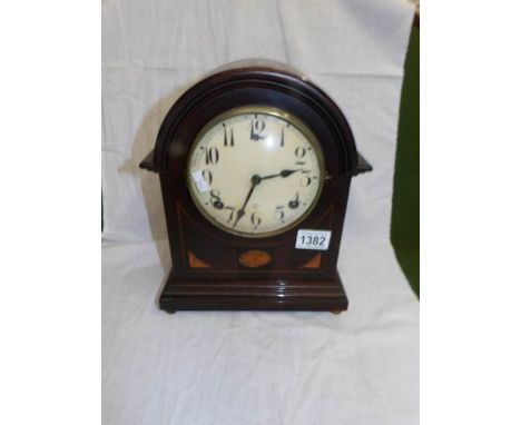 A mahogany inlaid bracket clock.