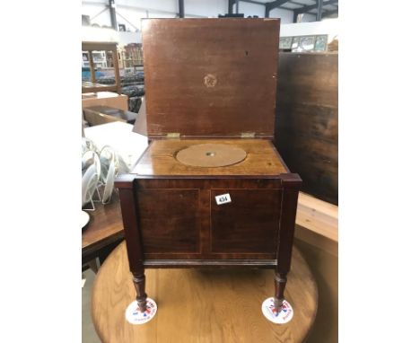 An inlaid mahogany commode