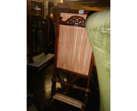 A mahogany fire screen