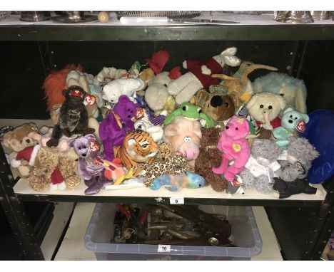 A shelf of soft toys including Ty Beanie Babies