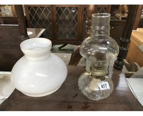 An oil lamp and a shade
