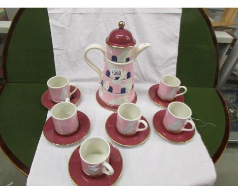 A Carlton ware coffee set comprising coffee pot with 6 cups and saucers featuring doves and dovecote.