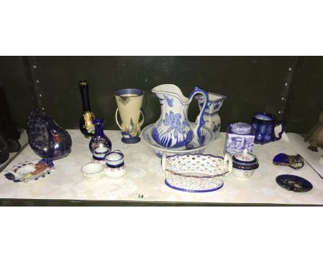 A shelf of pottery and china