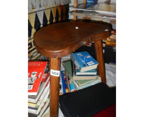 A 3 legged stool featuring a figure of a mouse.