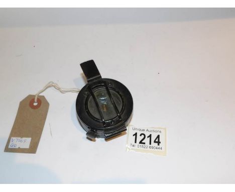 A military compass with war office arrow marked 'T.G. Co., Ltd., London, NO. B6382, 1939, MKIII'.