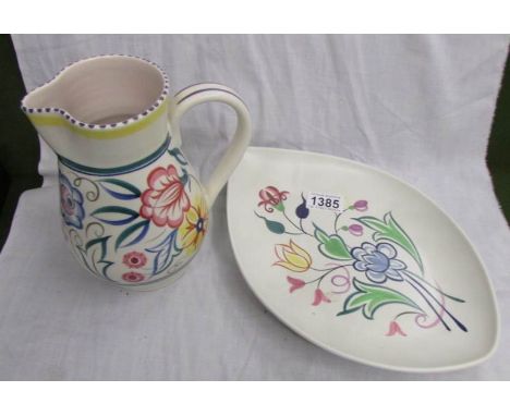 A Poole pottery jug and plate.