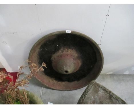 A cast iron feeding trough