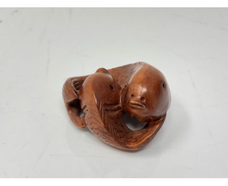 A carved Chinese hardwood netsuke  - Two carp