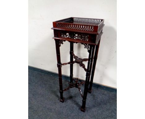 A reproduction Chippendale style fret work plant stand  