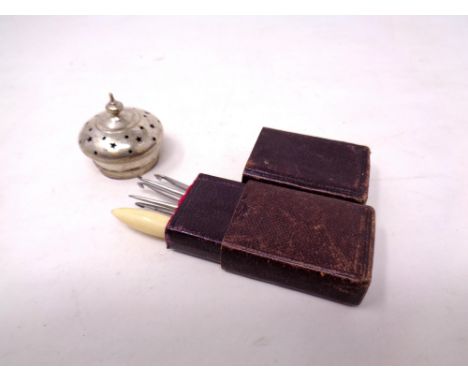 A small vintage sewing set together with pepper pot top