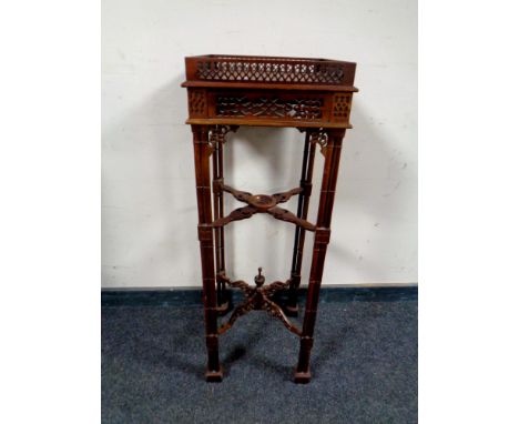 A reproduction Chippendale style fret work plant stand  