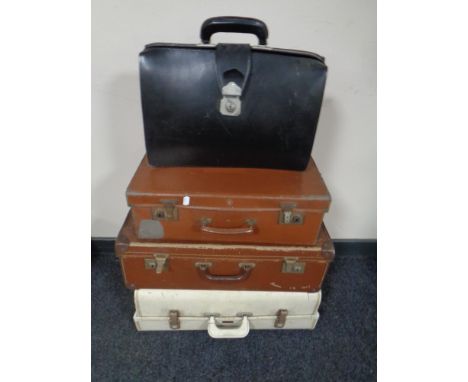 Three 20th century vintage luggage cases together with a leather business bag 