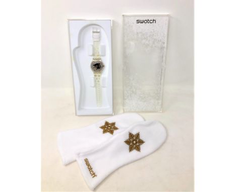 A Swatch Snow Your Time Away watch with mittens in box. 
