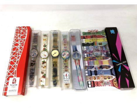 A group of five various Swatch watches in plastic cases, together with A Beijing 2002 watch, London 2012 watch etc. (8) 