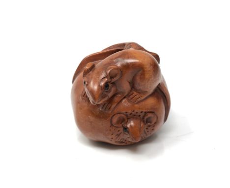 A carved Chinese hardwood netsuke  - Two rats on fruit