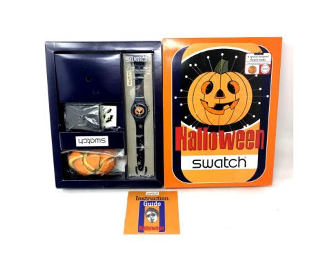 A Swatch Halloween Pumpkin watch in box. 