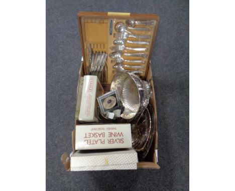 A box containing assorted plated wares to include lion mask handled punch bowl with ladle, cased cutlery etc    