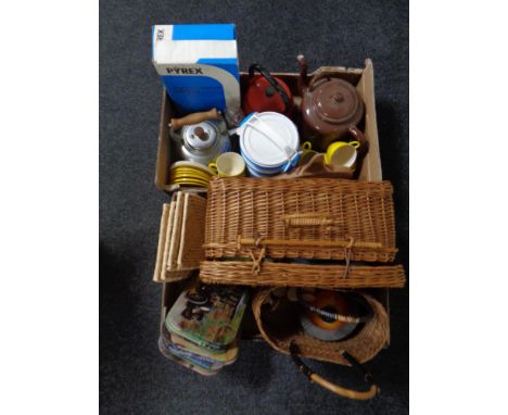 Two boxes containing 20th century enamelled teapots, wicker hamper with contents, place mats, plastic tea ware etc   