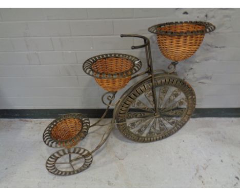 A metal penny farthing planter  
