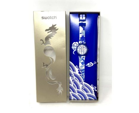 A Swatch Year of the Dragon watch in box. 