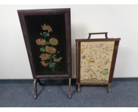 An early 20th century beech tapestry fire screen together with a further fire screen with a hand painted panel on fabric  
