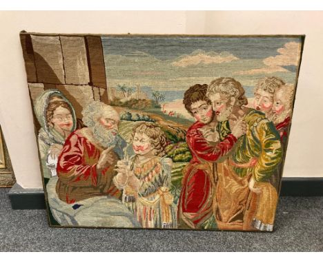 A nineteenth century tapestry depicting figures with a child, 81 cm x 56 cm.
