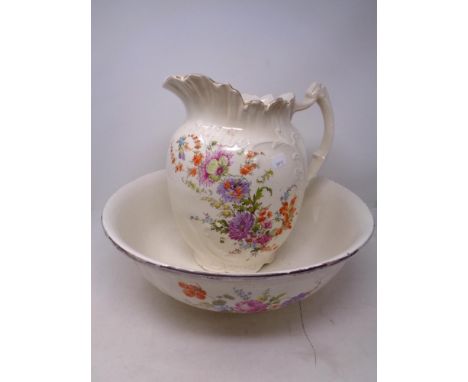 A 19th century floral patterned wash jug and basin  