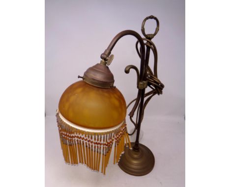 A brass Art Deco style table lamp with glass beaded shade  