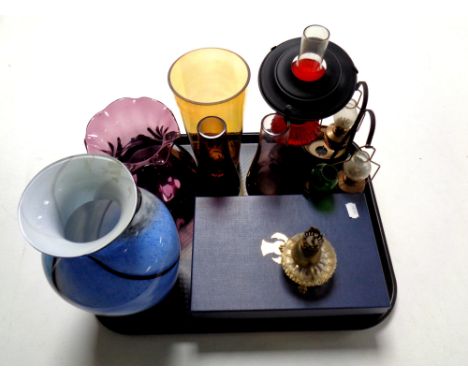 A tray containing assorted glassware to include coloured glass vases, pair of boxed tartan glass ruby wedding champagne flute