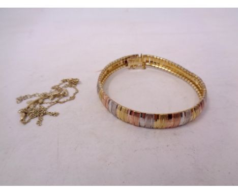 A silver gold plated bangle and necklace