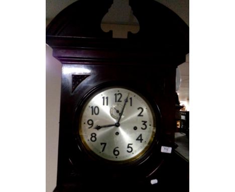 A continental longcase clock with barley twist supports and silvered dial, with weights