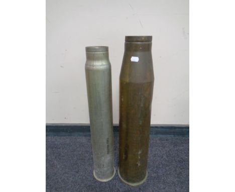 A brass ammunition shell casing together with one other  