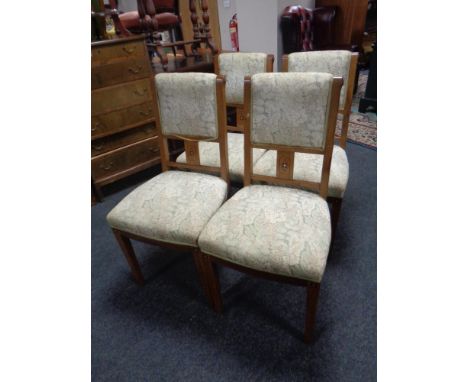 A set of four continental dining chairs upholstered in a tapestry fabric 