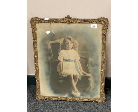An early twentieth century monochrome photographic print in ornate gilt frame depicting a child, 44 cm x 57 cm.