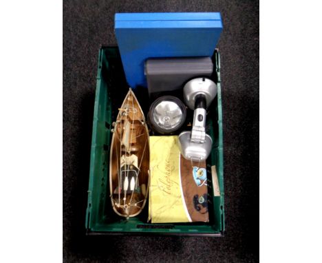 A crate containing cased Xylophone, boxed retro style telephone, wooden model of a trawler, torch table lamp etc   