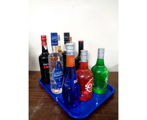 A tray containing nine bottles of alcohol to include Cockburn's Port (75cl), Taboo Infused Vodka (70cl), Archer's Schnapps (7