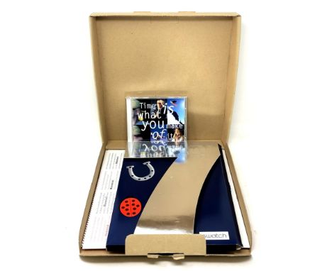 A Swatch Lucky 7 watch in box. 