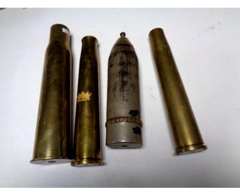 Four brass ammunition shells 